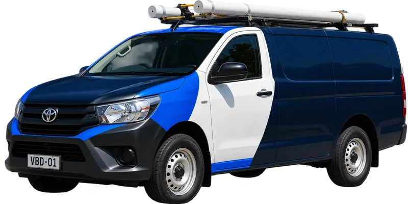 A licensed Liverpool plumbing van loaded with pipe on the roof rack